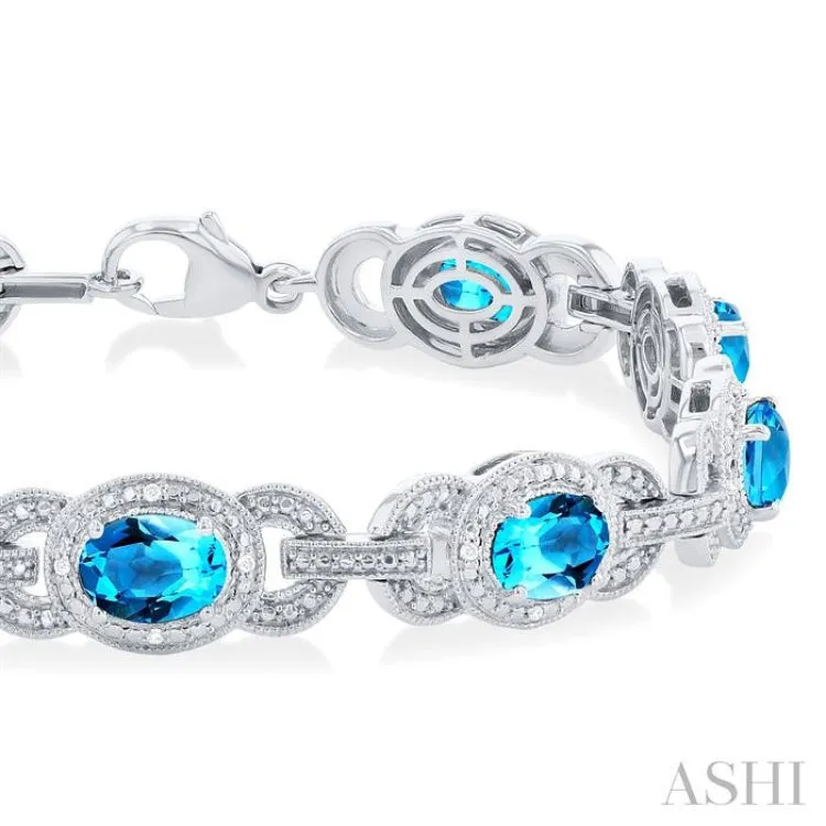 1/10 ctw Oval Shape 7x5 MM Blue Topaz and Round Cut Diamond Semi Precious Bracelet in Sterling Silver