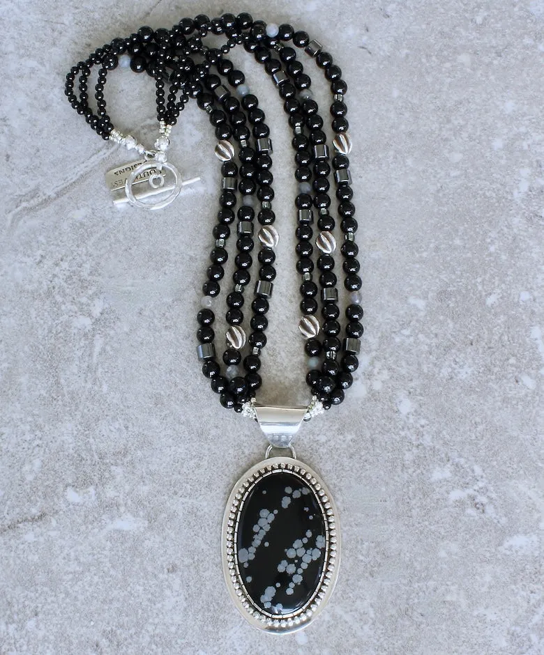 Snowflake Obsidian and Sterling Silver Oval Pendant with 3 Strands of Black Onyx Rounds, Hematite Drum Beads, Hill Tribe Silver Spiral Ovals, and a Hammered Sterling Silver Toggle Clasp