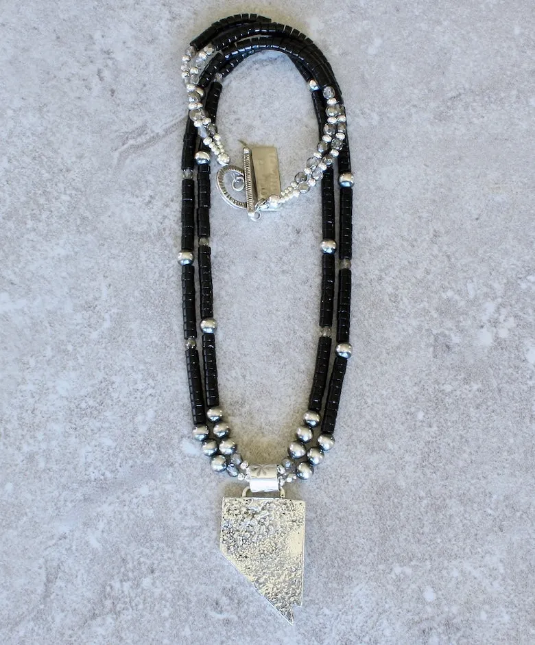 State of Nevada Reticulated Silver Pendant with 2 Strands of Black Onyx Heishi, Oxidized Sterling Silver Rounds, and a Sterling Silver Toggle Clasp